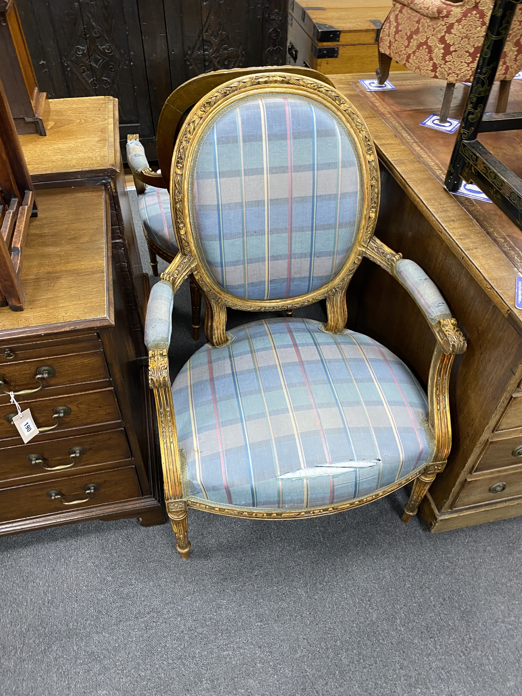 A set of four Louis XVI style giltwood and composition fauteuil, width 64cm, depth 54cm, height 107cm